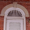 Either the original or a replica of the original exterior backdoor fanlight.