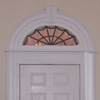 Early nineteenth century fanlight preserved and placed above the interior backdoor created in 
                                 the 1935 renovation.