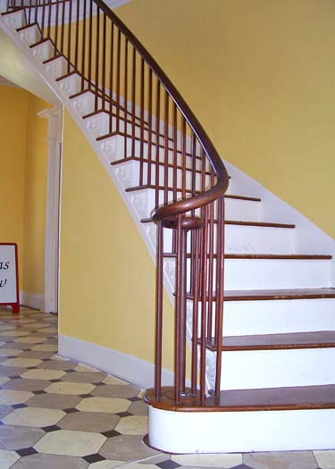 Curved, thin Federal Style banisters and balusters in James Vanderpool House, Kinderhook, New York. 