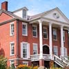 Apfell Federal Style House in 2009 with interior and exterior updates from Greek 
                                  Revival, Italianate, Colonial Revival, and Art Deco architectural periods. 